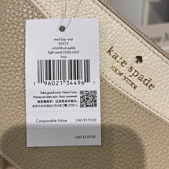Kate Spade Medium Lucy Colorblock L-Zip Wristlet Pebble Leather 
Light Sand 
NWT - Picture 6 of 16